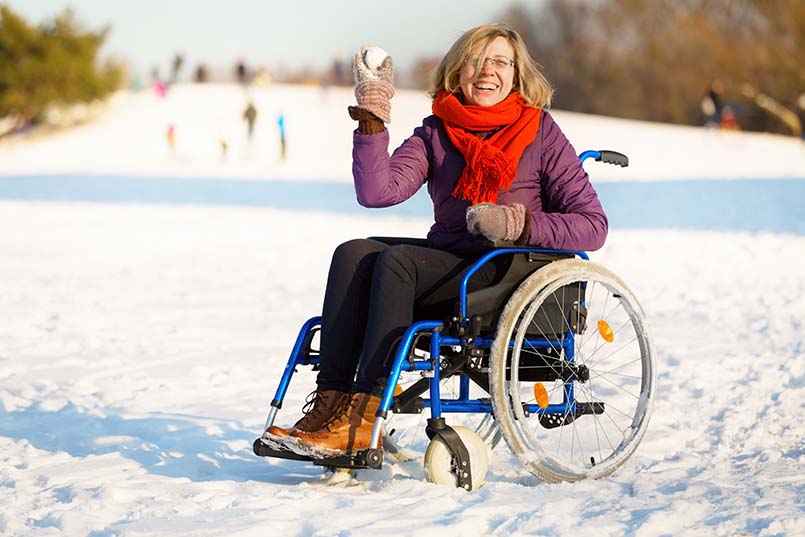 woman on wheelchair in snow